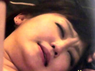 Asian girl watched while giving oral pleasure with enthusiasm.